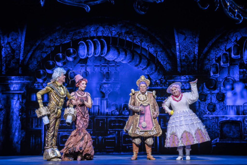four of the supporting characters on stage together.