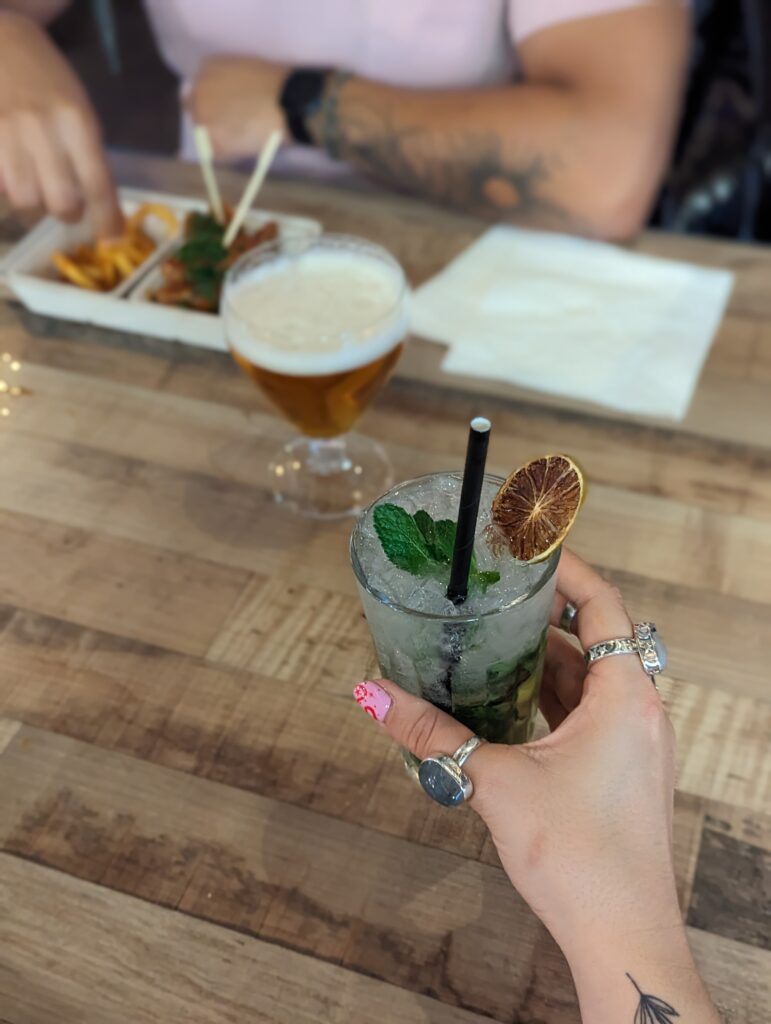 a cocktail, a beer and fried chicken